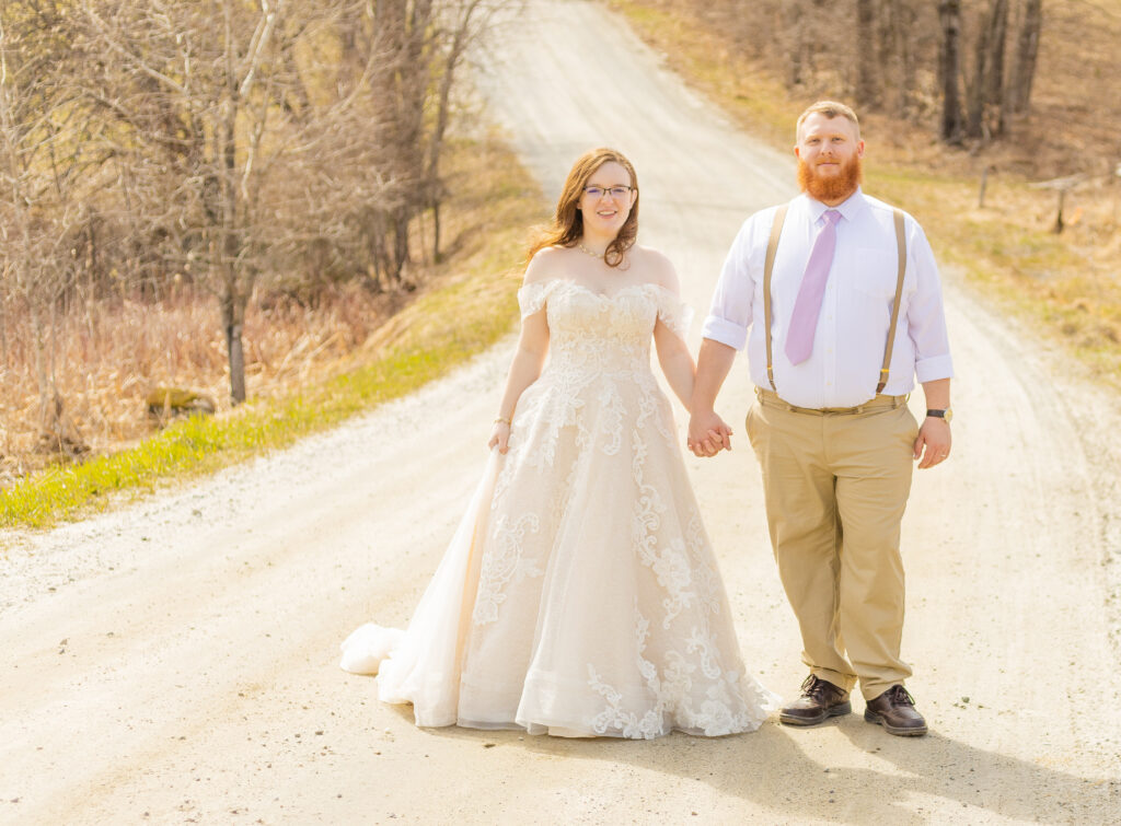 A bride and groom walk together after just eloping in the white mountains.