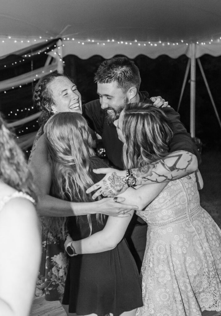 The groom dances with some really great friends during his wedding reception. 