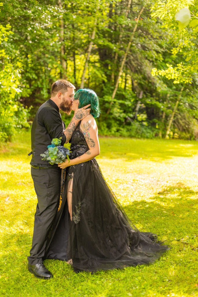 bride and groom share a kiss at their groveton new hampshire wedding 