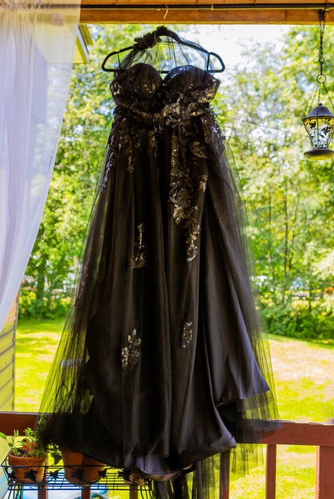 The bride's dress hung up before the ceremony at their outdoor venue in NH.