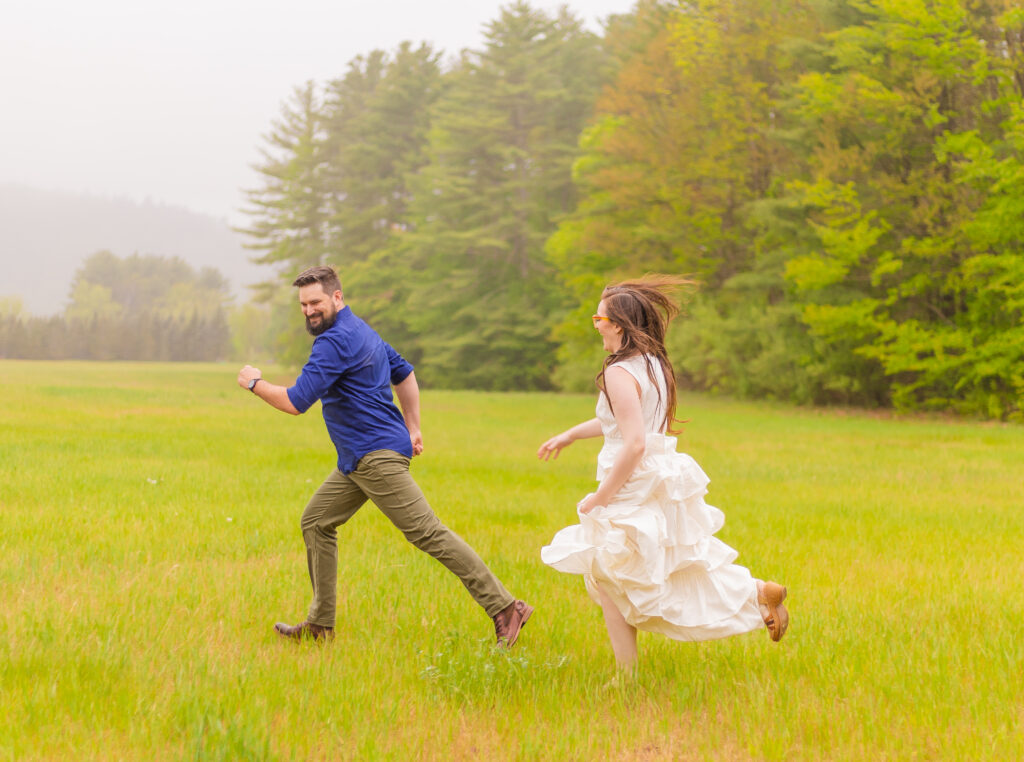 a couple plays tag at a nh engagement photo location