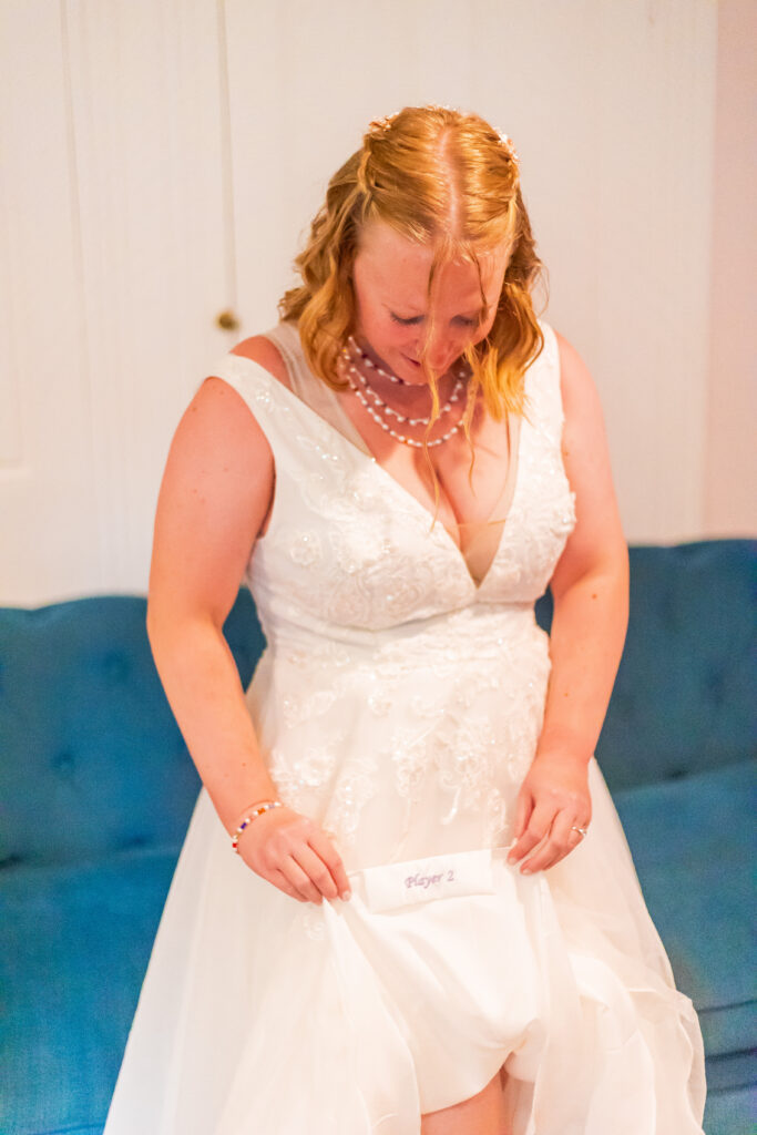 The bride shows offer video game reference on her dress