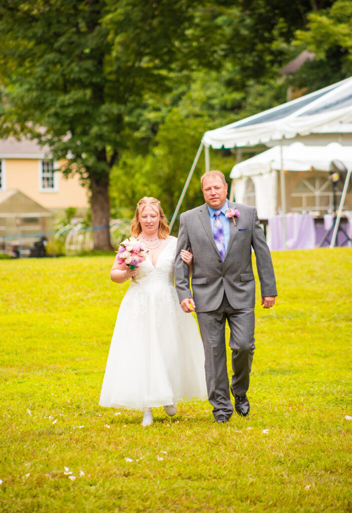 Bride and Dad walking down the aisle at a wedding in NH.