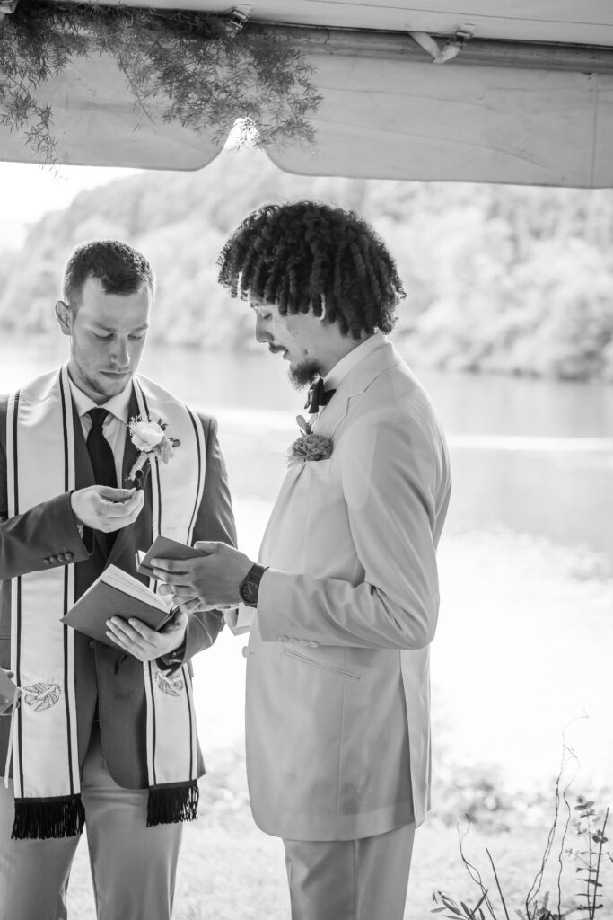 The groom reads his vows to his future wife.