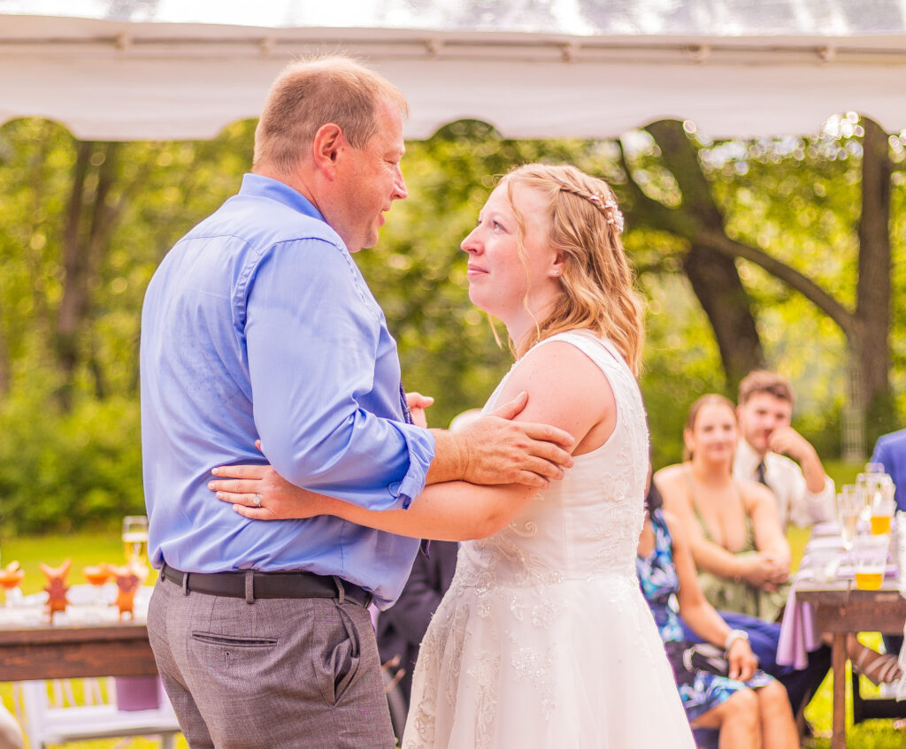 Dad and daughter share a dance at her wedding.