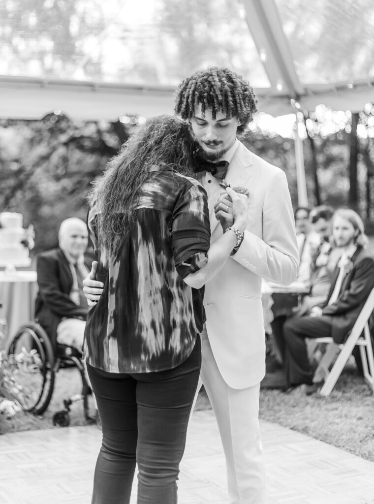 Mother and son share their first dance.