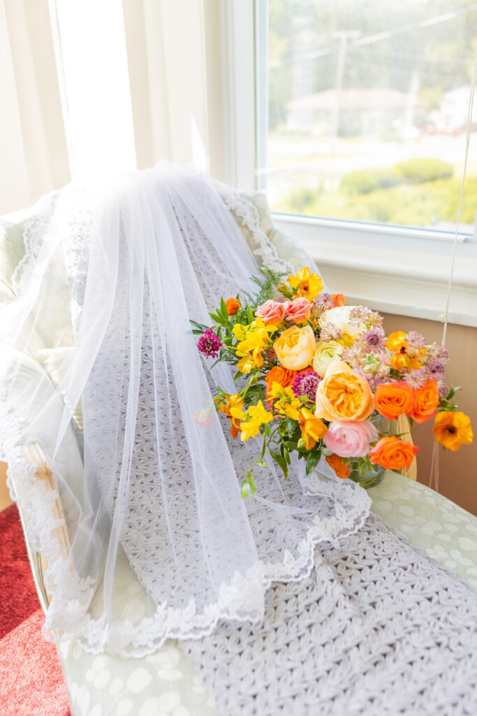 Veil and wedding bouquet in the bridal suite at the Victoria Inn in Hampton NH.