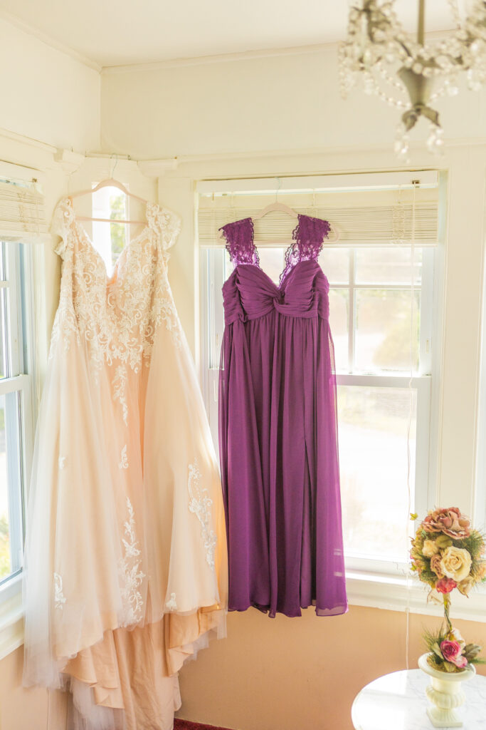 Bride and maid of honor's dress hanging in the bridal suite in NH.