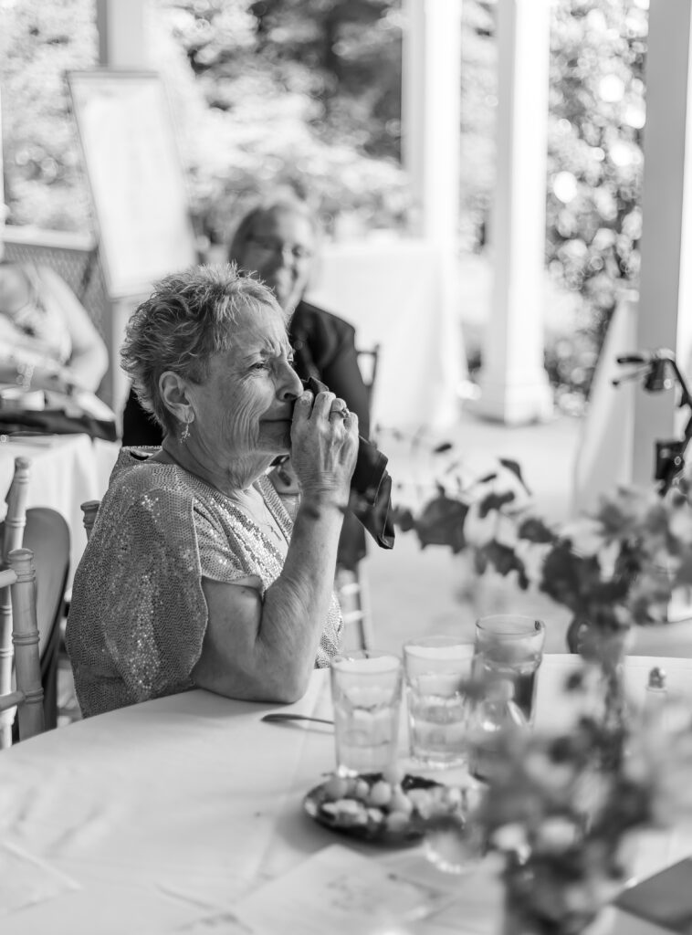 The mother of the bride is emotional during a wedding speech given at ther daughter's wedding at the Victoria Inn.