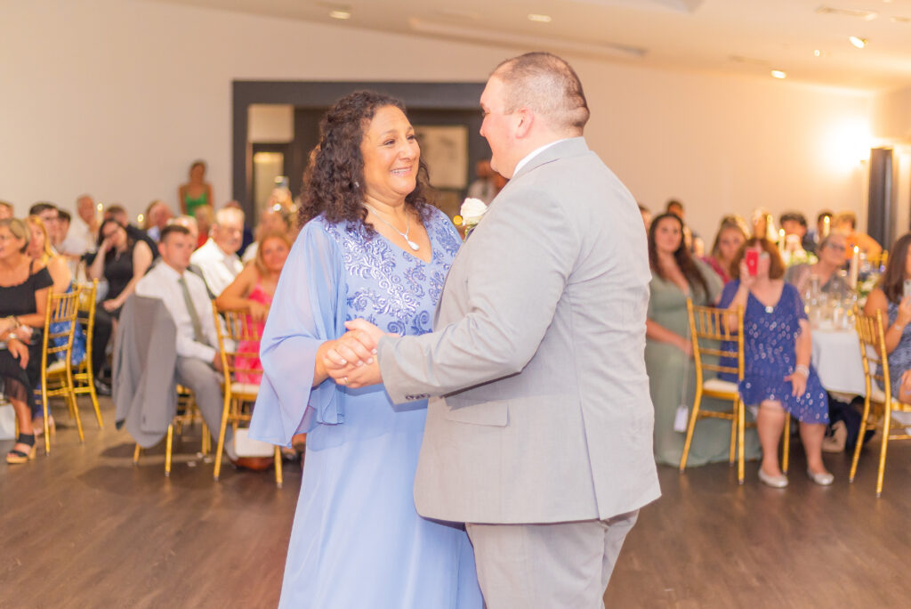 Groom and mother sharing a dance at a classy ballroom wedding venue in NH.