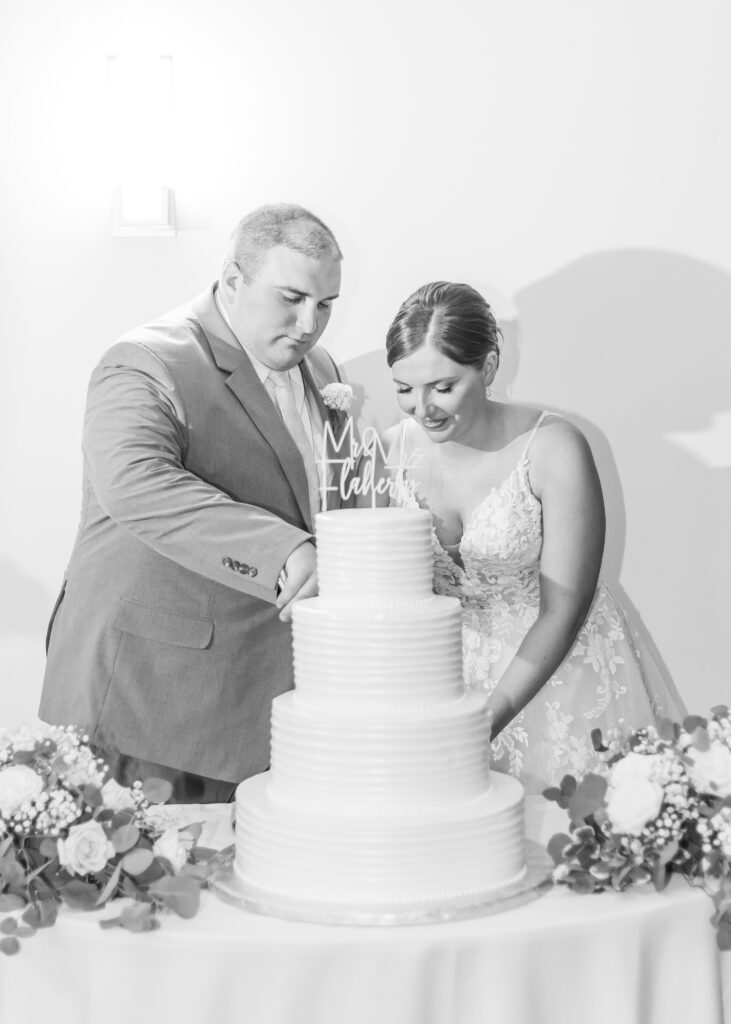 Bride and groom cutting their wedding cake.