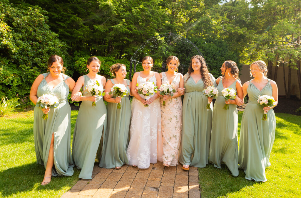 Bridal party walking together at a Wedgewood Wedding venue in New England.