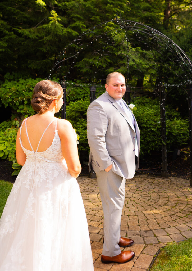 Bride and groom share a first look in the gardens at the Granite Rose in Hampstead, NH.