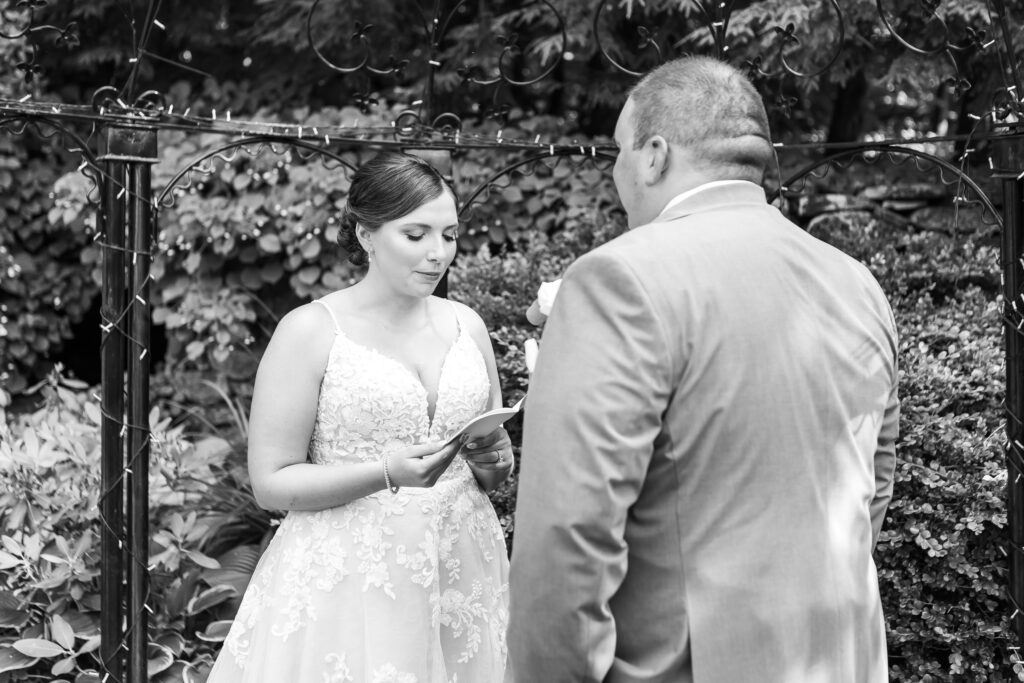 Bride reading her private vows to her groom.