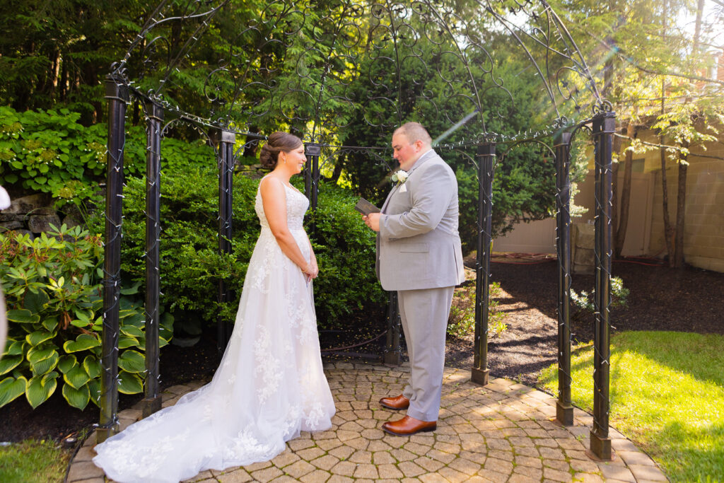 Groom reading his vows to his future wife. 