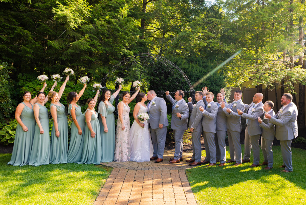 Wedding party cheering for the bride and groom.