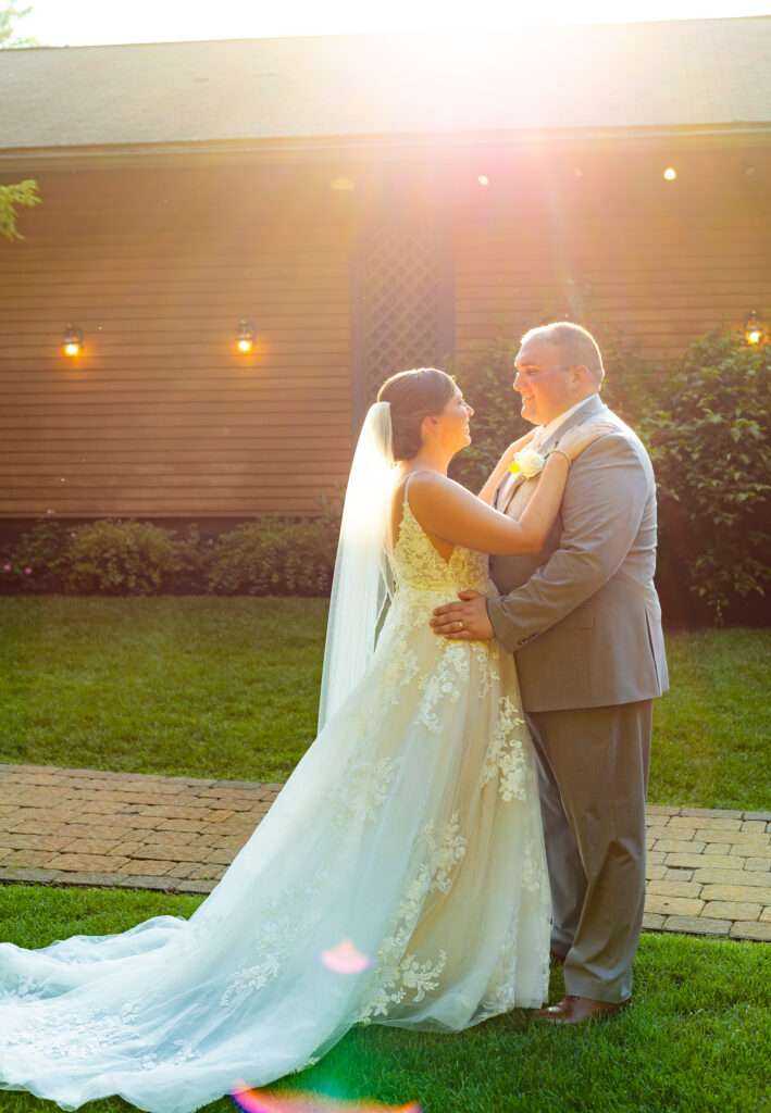 Bride and groom look into each others eyes during their golden hour wedding portraits.