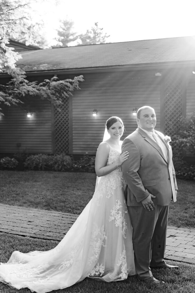 Bride and groom in the light of golden hour at their wedding near Manchester, NH.