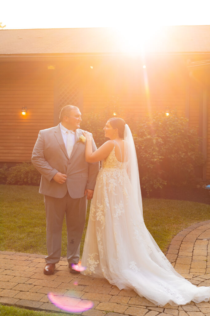 Bride and groom during golden hour at a whimsical garden wedding venue in NH.