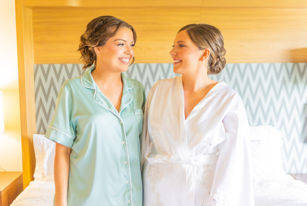 bride laughing with her sister