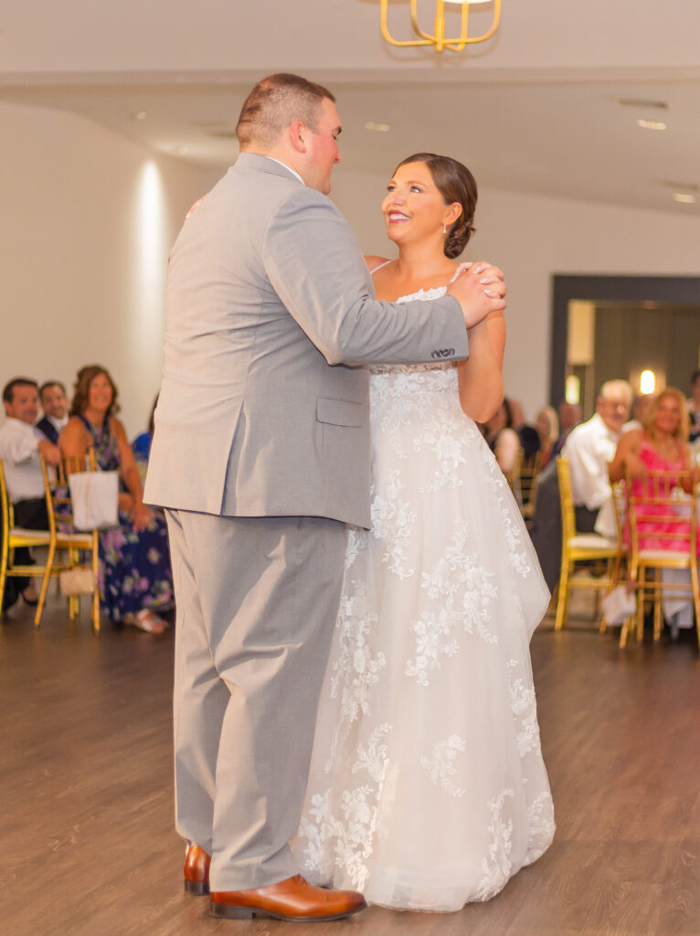 Bride and groom sharing a first dance.