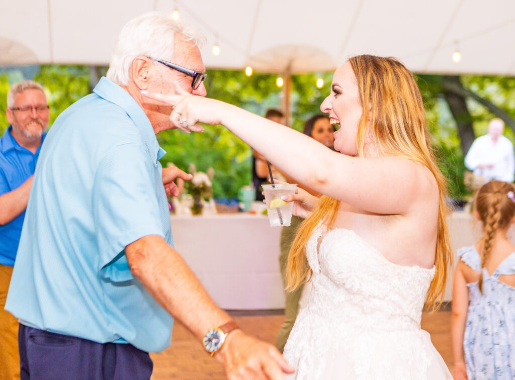 Bride dancing with a guest.