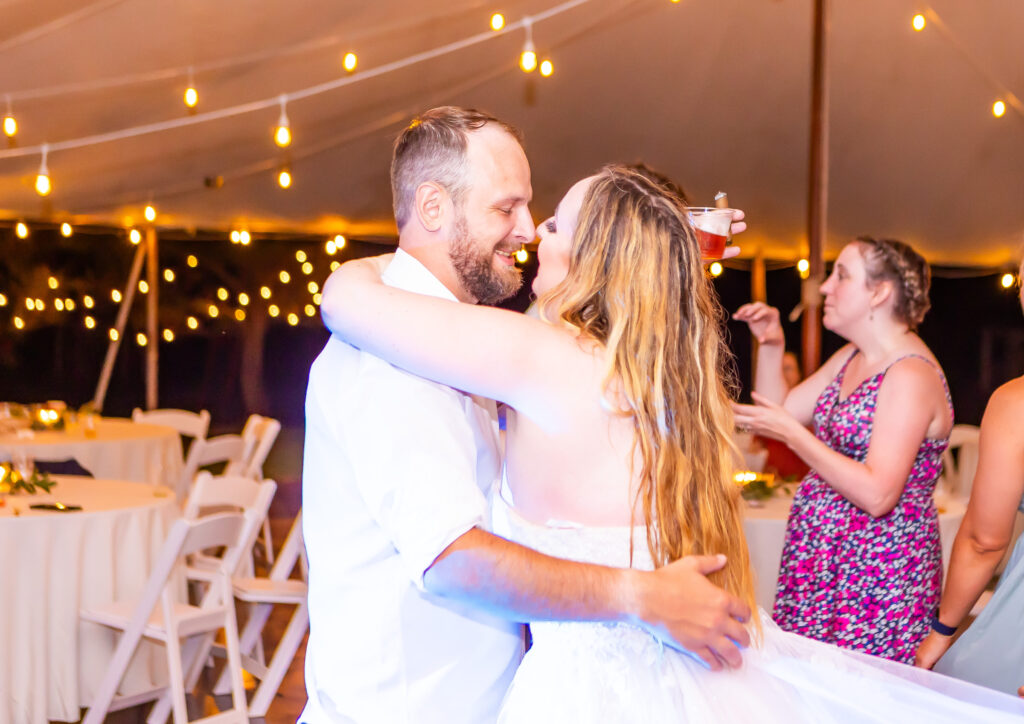 Bride and groom singing at their wedding reception in NH.