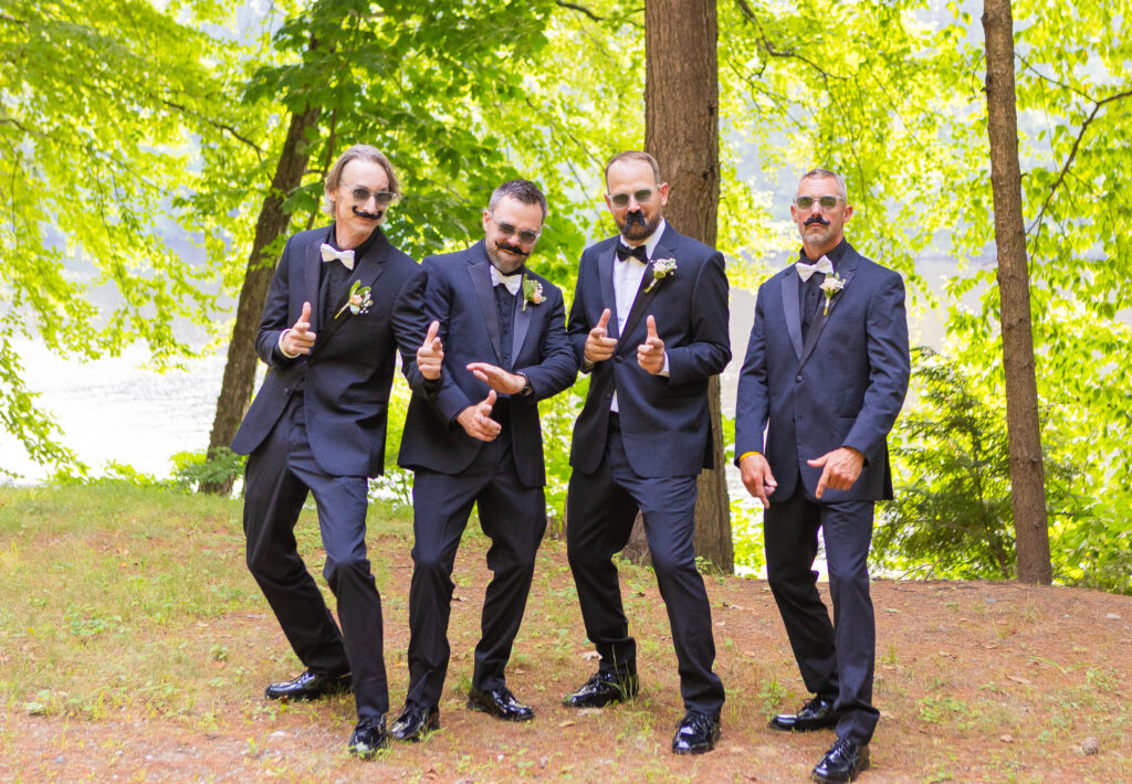 Groomsmen wearing mustaches.