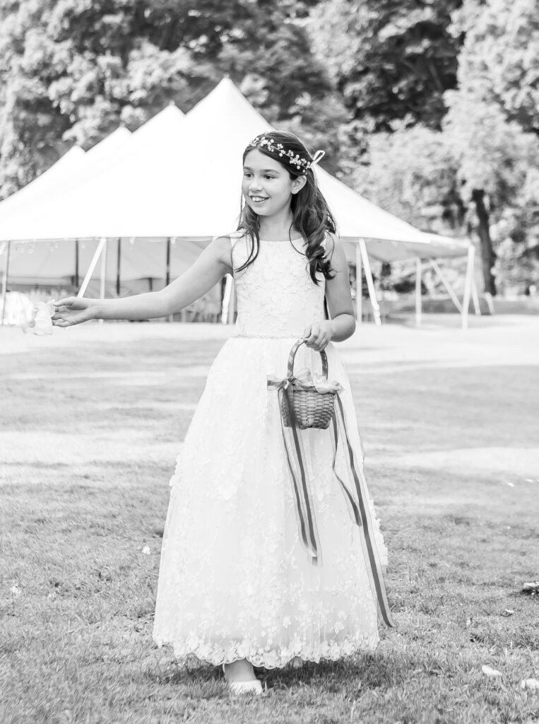 Flower girl throwing flowers.