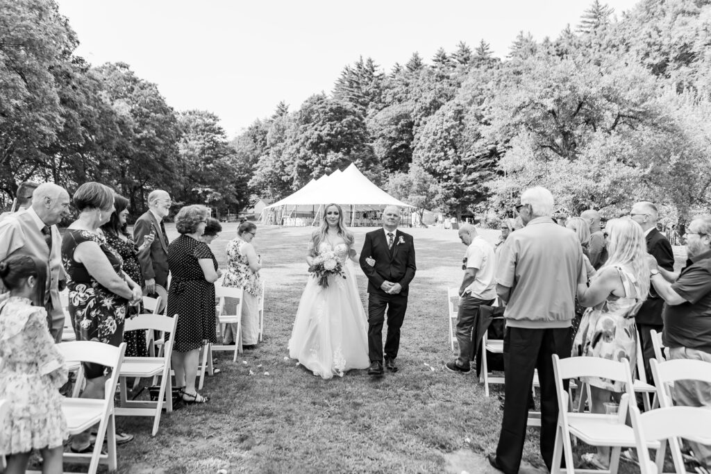 Bride and father walking down the aisle.