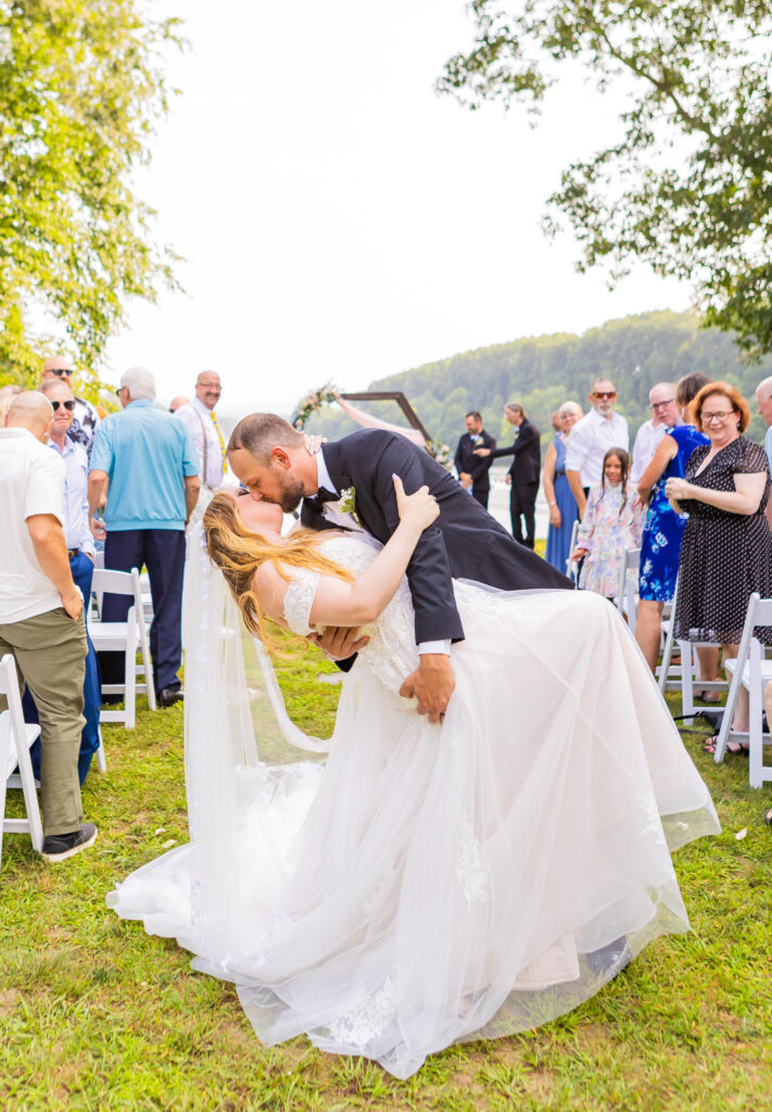 Bride and groom share kiss at Stone Garden in NH/