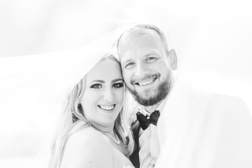 Bride and groom under the veil at a New Hampshire wedding.