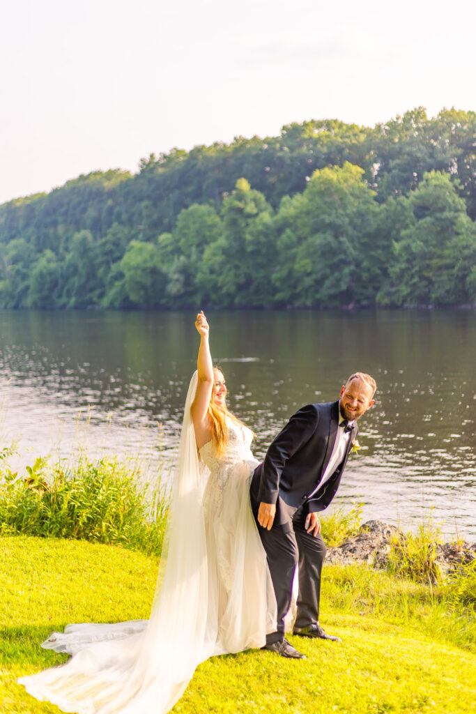 Bride and groom being silly during wedding portraits.