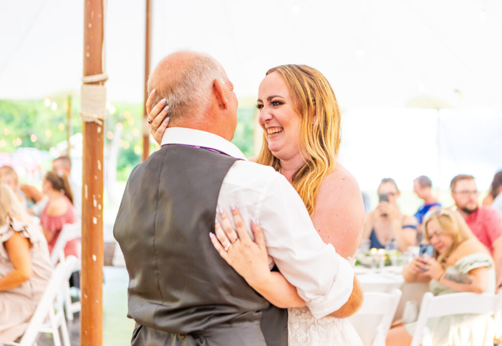 Bride and her dad share a father daughter dance.