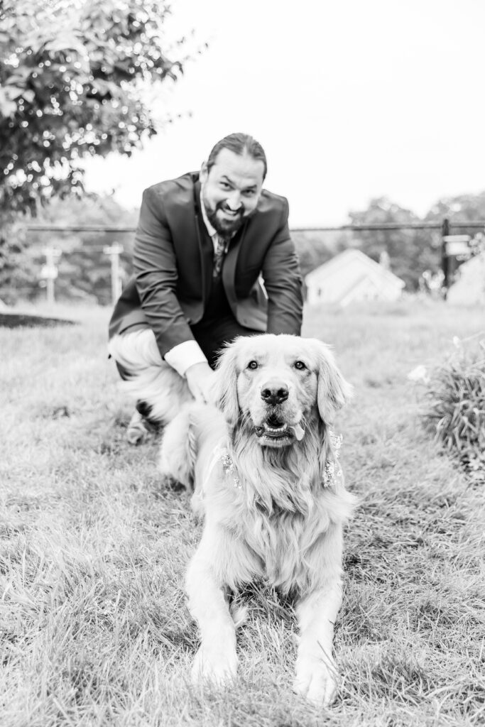 Groom petting his dog Gilligan.