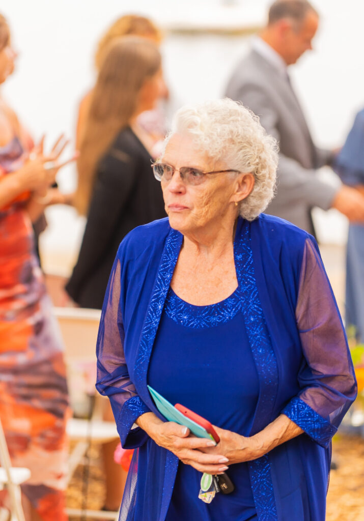 Grandmother walks up the aisle.