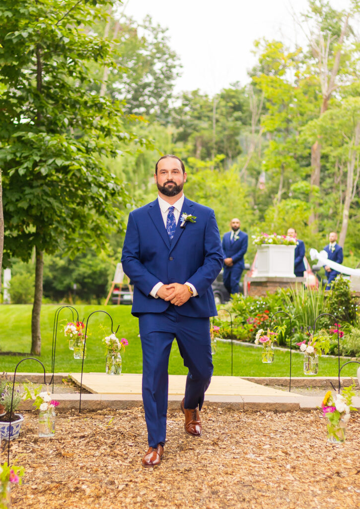 groom walking down the aisle