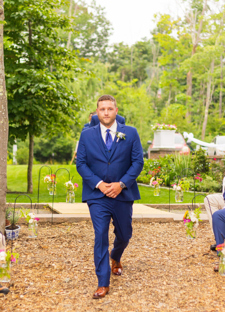 Groomsmen walking down the aisle