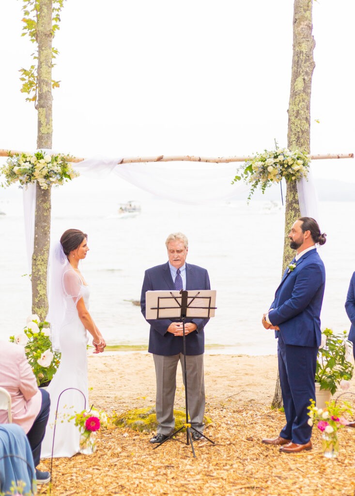 Bride and groom listening to vows.