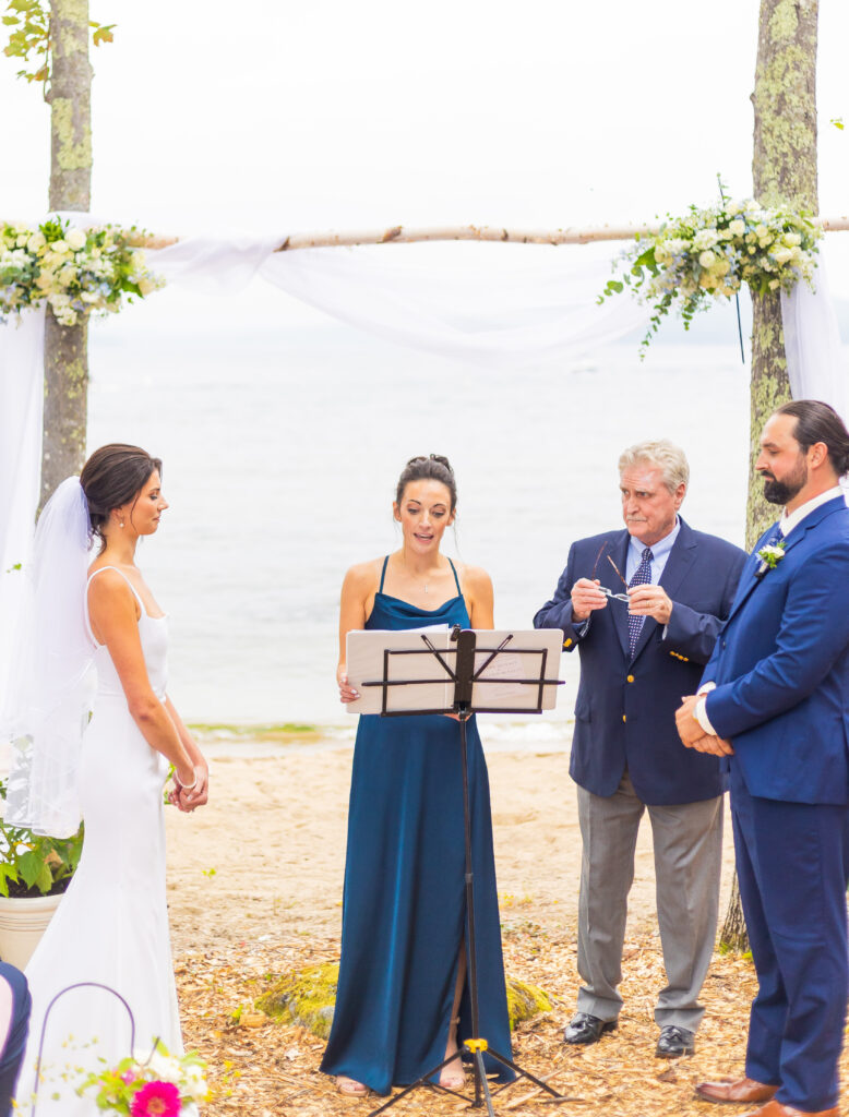 The bride's sister reads a poem during the wedding ceremony in Laconia, NH.