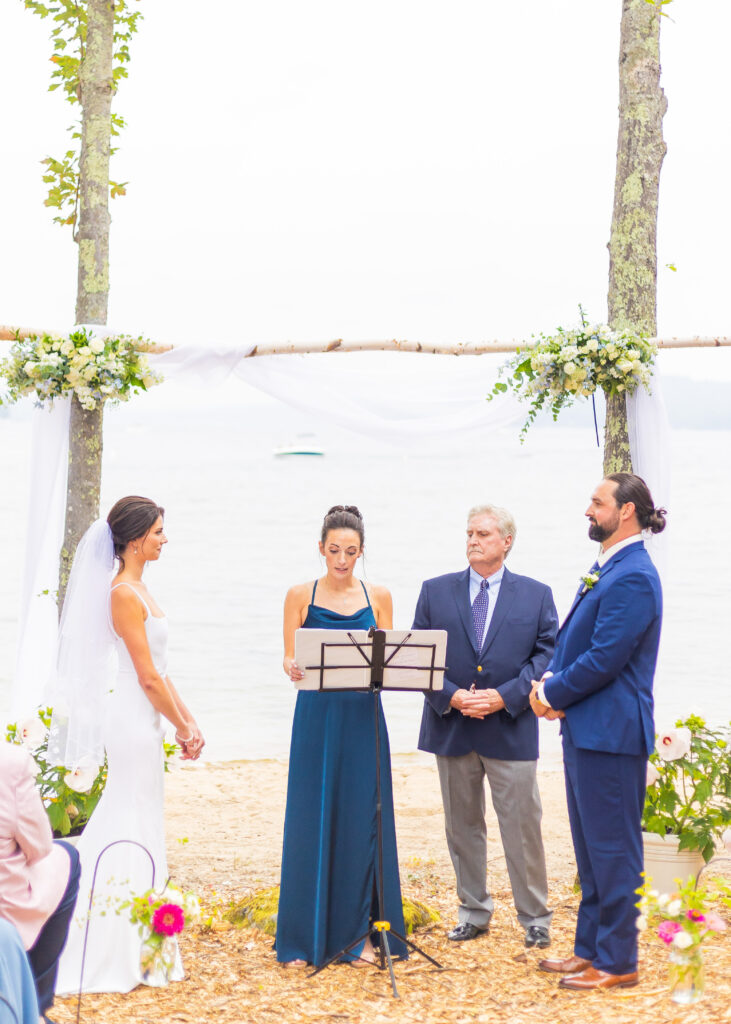 Sister reads a poem at a NH Lakes region wedding.