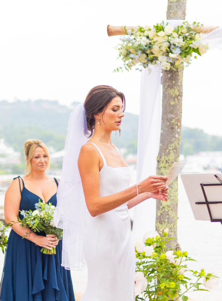 The bride reads her vows to her groom.