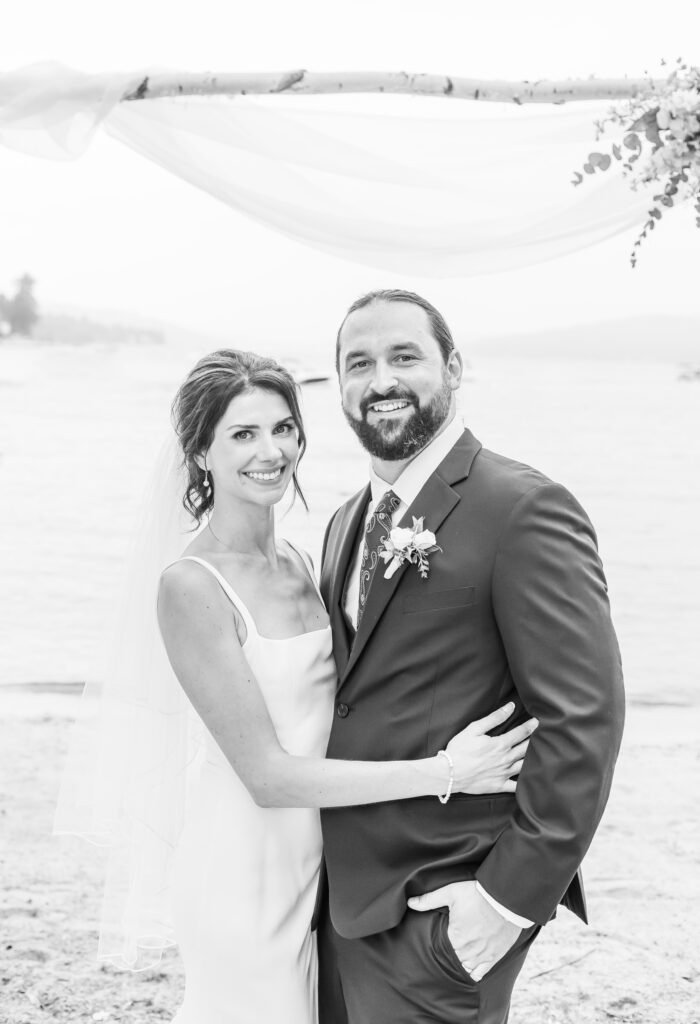 Bride and groom on their wedding day in front of Weirs Beach.