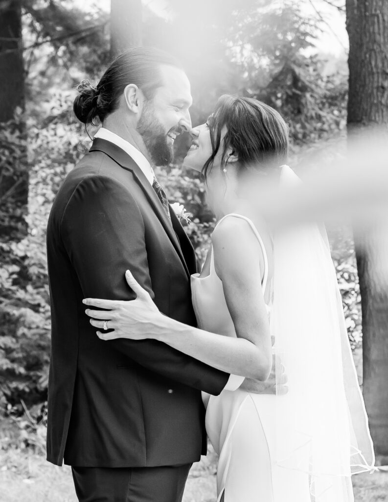 Bride and groom share a laugh on their wedding day in New Hampshire.