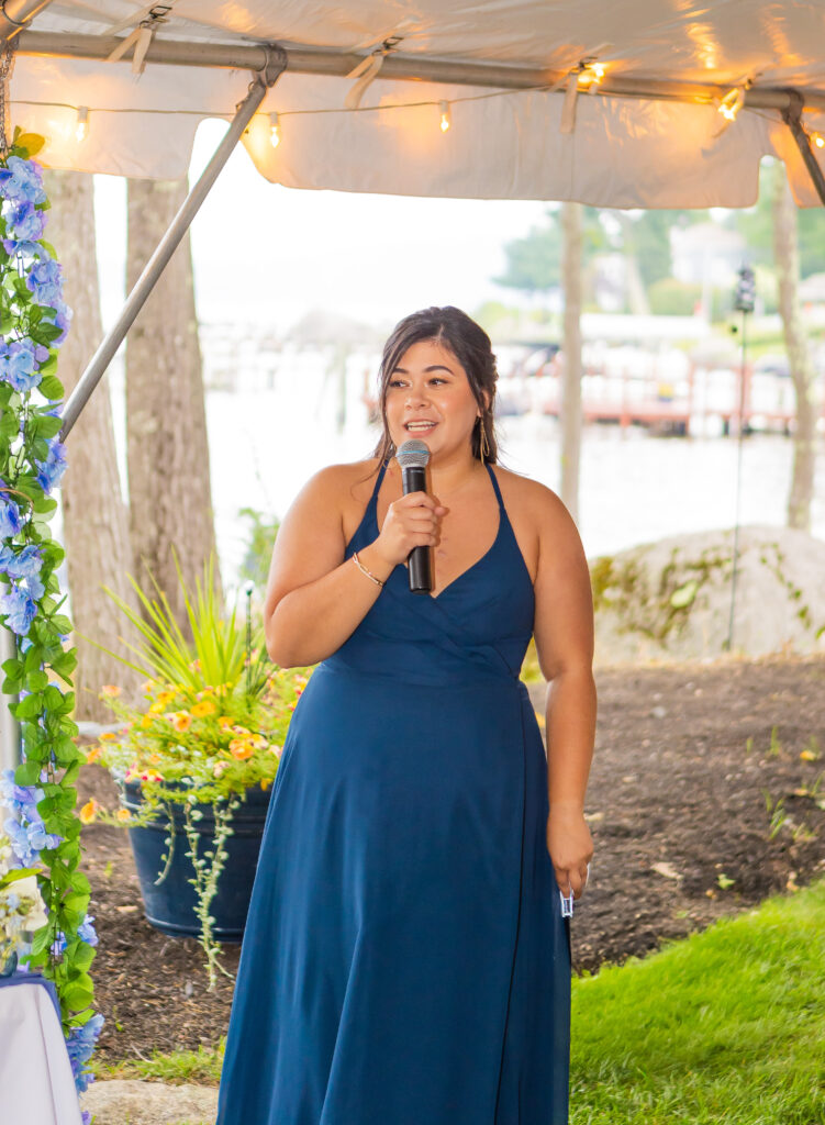 Maid of honor gives a speech.