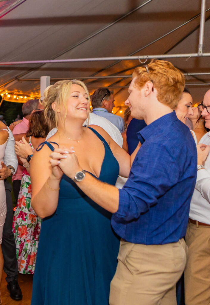 Bridesmaid sharing a dance with her BF.