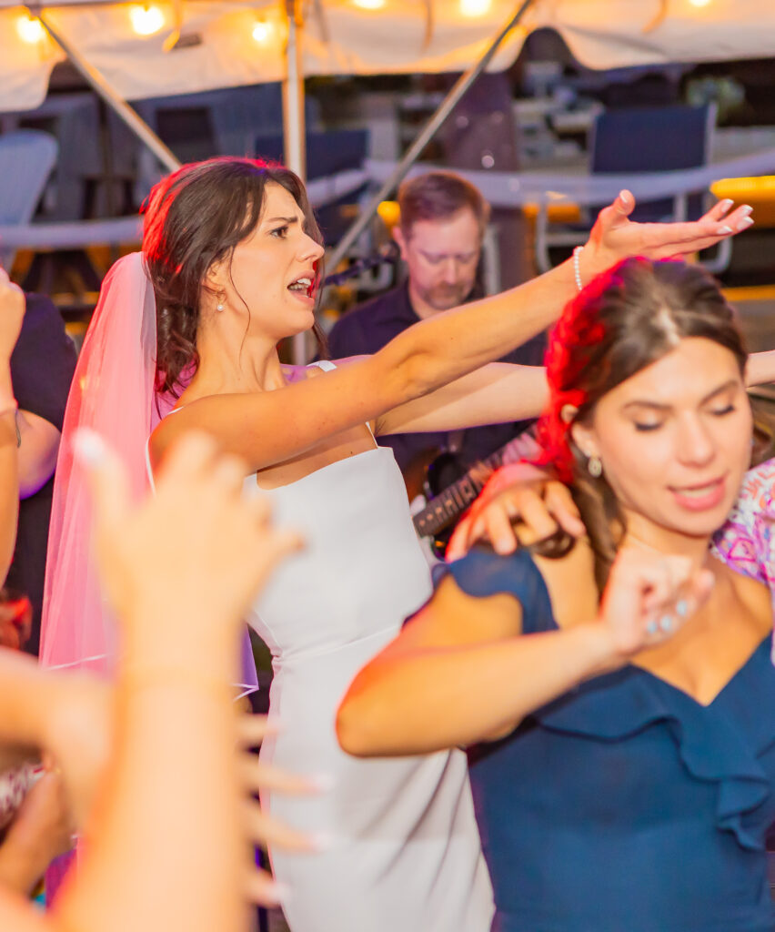 Bride sings her favorite song on the dance floor.