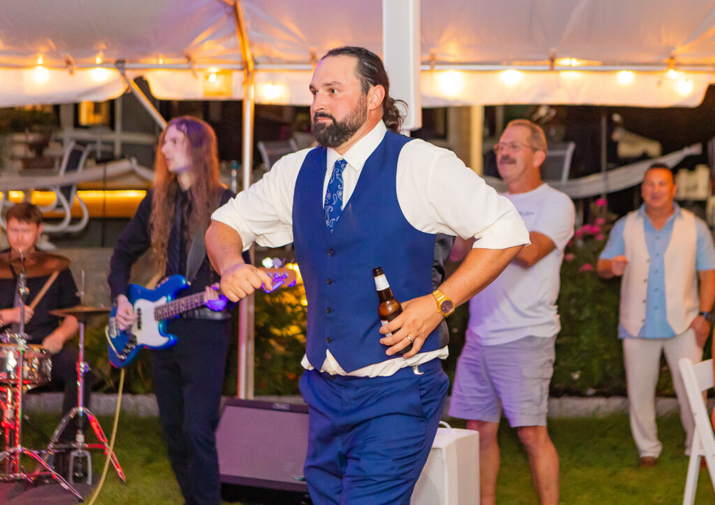 Groom dancing at his wedding.