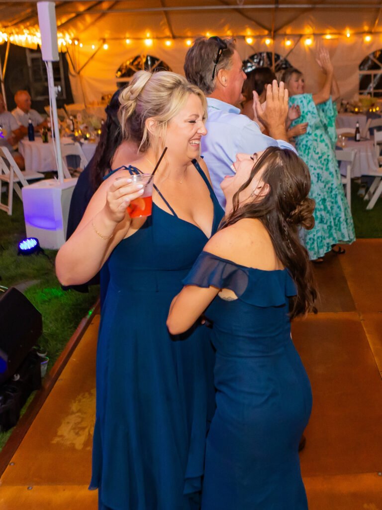 Bridesmaids laughing and dancing together