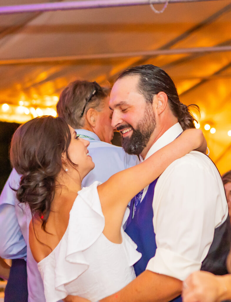 Bride and groom sharing a last dance of the evening on their wedding day.